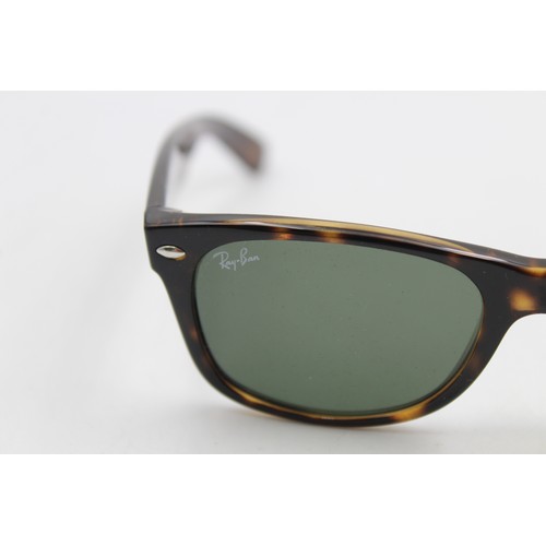 215 - A pair of cased classic Ray-Ban Wayfarer tortoiseshell effect sunglasses