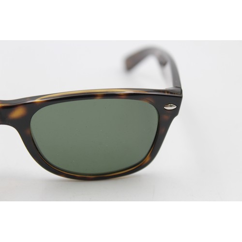 215 - A pair of cased classic Ray-Ban Wayfarer tortoiseshell effect sunglasses