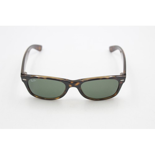 215 - A pair of cased classic Ray-Ban Wayfarer tortoiseshell effect sunglasses