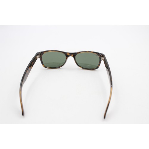 215 - A pair of cased classic Ray-Ban Wayfarer tortoiseshell effect sunglasses