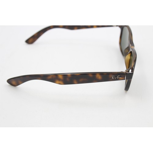 215 - A pair of cased classic Ray-Ban Wayfarer tortoiseshell effect sunglasses