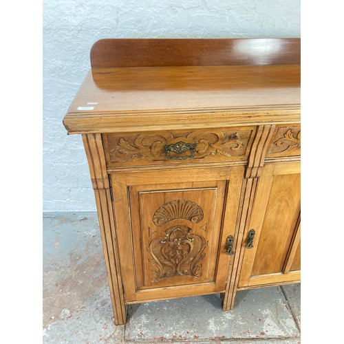 1005A - An Art Nouveau mahogany sideboard with three upper drawers and three lower cupboard drawers - approx... 