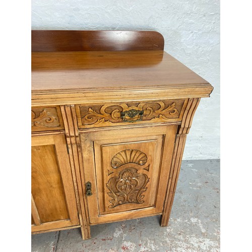 1005A - An Art Nouveau mahogany sideboard with three upper drawers and three lower cupboard drawers - approx... 