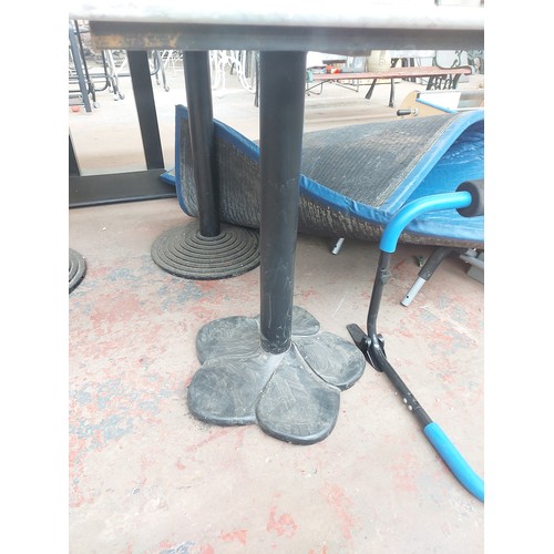 1241 - A marble top bistro/café table on black metal pedestal supports - approx. 77cm high x 60cm wide x 65... 