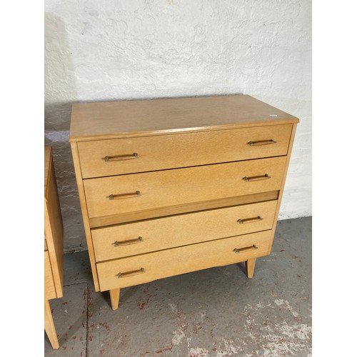 1028A - A mid 20th century oak effect two piece bedroom suite comprising chest of four drawers - approx. 81c... 