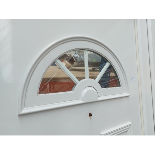 1279A - A modern white PVC front door with frame, glass and seals