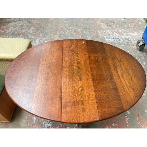 1047A - Six assorted pieces of furniture, oak drop leaf gate leg dining table, oak side table, brown rug, te... 