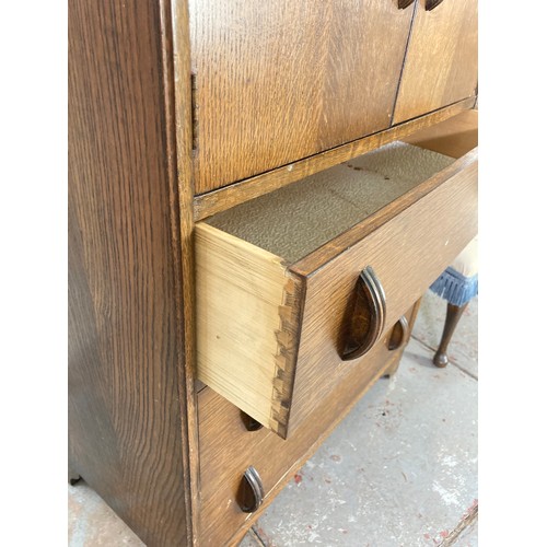 1010A - Two pieces of furniture, Art Deco style oak bedroom cabinet with two doors and three lower drawers a... 