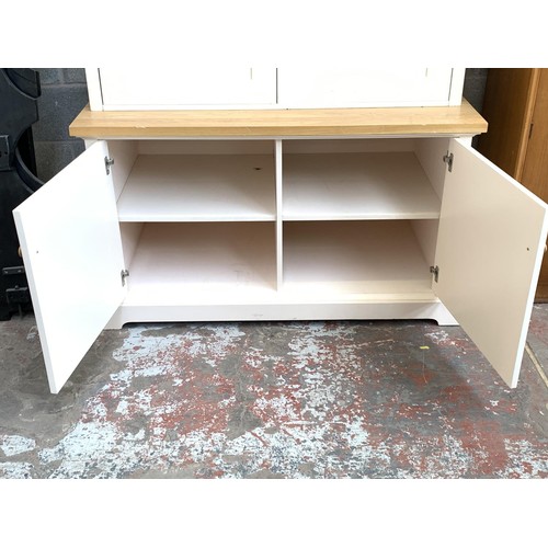 1092A - A modern oak and off white painted housekeepers/larder cupboard with two lower drawers, two upper do... 