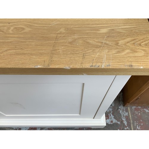 1092A - A modern oak and off white painted housekeepers/larder cupboard with two lower drawers, two upper do... 