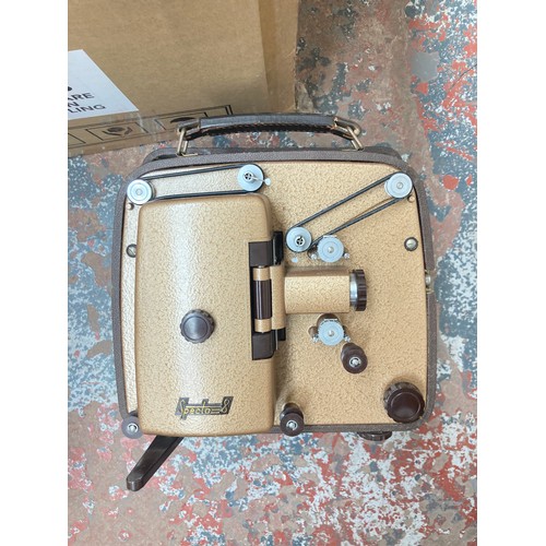 1450 - A box containing Specto 8 cine-camera, converted brass candle stick table lamp, pair of Italian made... 