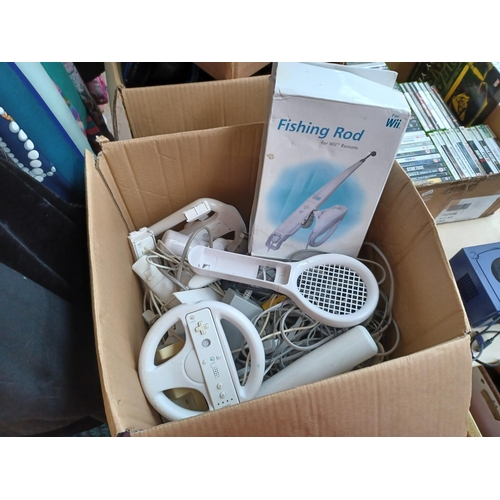 A box containing a large quantity of Nintendo Wii accessories to include  boxed fishing rod, steering