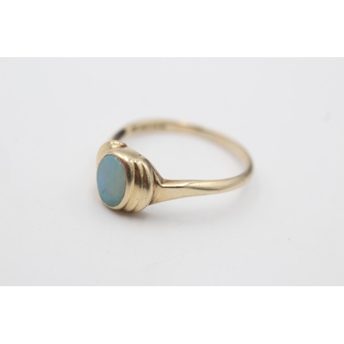 11 - A hallmarked Sheffield 9ct gold opal bevel set ring, size T - approx. gross weight 3 grams