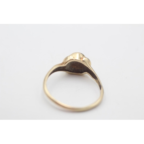 11 - A hallmarked Sheffield 9ct gold opal bevel set ring, size T - approx. gross weight 3 grams