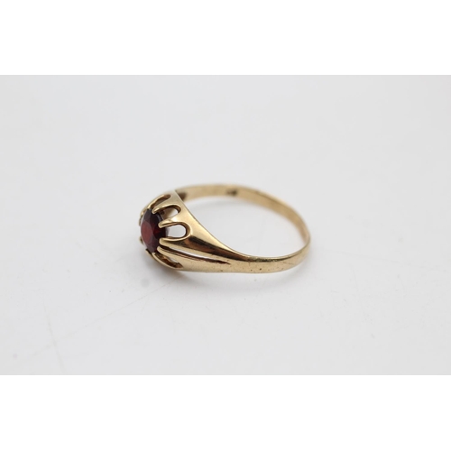 13 - Two 9ct gold garnet dress rings, one buttercup solitaire, size T and one cluster, size P½ - approx. ... 