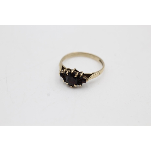 13 - Two 9ct gold garnet dress rings, one buttercup solitaire, size T and one cluster, size P½ - approx. ... 