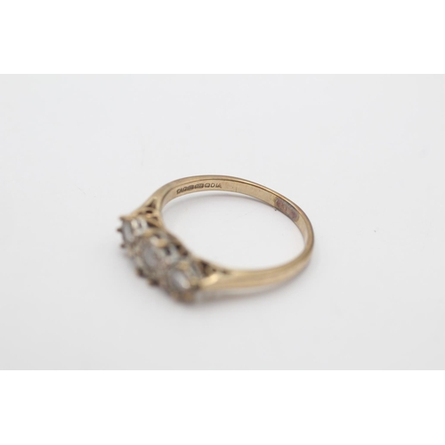 24 - A hallmarked Sheffield 9ct gold diamond three stone illusion setting ring, size M - approx. gross we... 