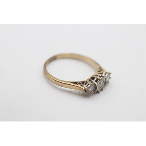 24 - A hallmarked Sheffield 9ct gold diamond three stone illusion setting ring, size M - approx. gross we... 