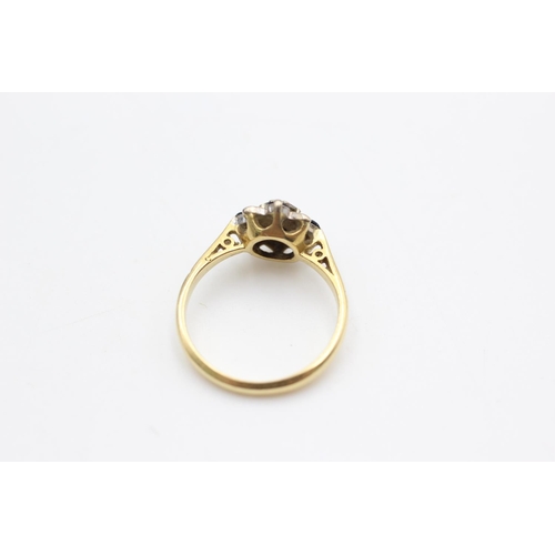 29 - An 18ct gold sapphire and central diamond ring, size J½ - approx. gross weight 2.8 grams