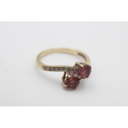 3 - A hallmarked Birmingham 9ct gold purple gemstone and diamond toi et moi ring, size O - approx. gross... 