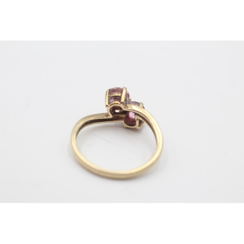 3 - A hallmarked Birmingham 9ct gold purple gemstone and diamond toi et moi ring, size O - approx. gross... 