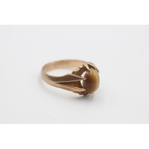 30 - A mid 20th century hallmarked Birmingham 9ct gold tiger's eye cabochon cocktail ring, size R - appro... 