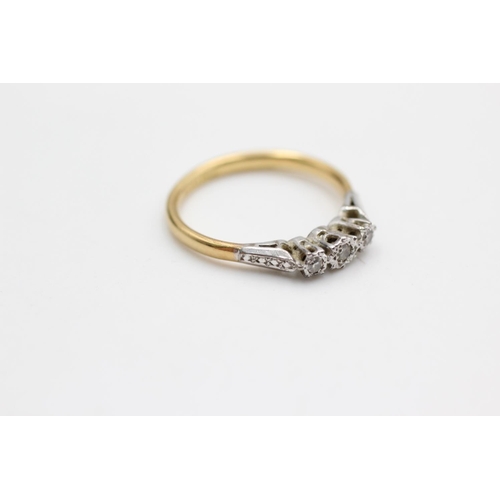 41 - An 18ct gold and platinum diamond trilogy ring, size M - approx. gross weight 2.2 grams