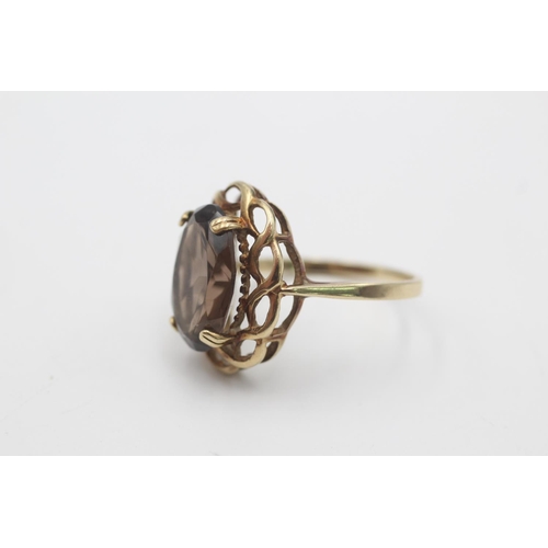 55 - A hallmarked Sheffield 9ct gold smoky quartz twisted frame cocktail ring, size P - approx. gross wei... 