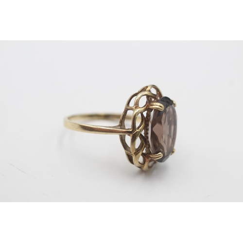 55 - A hallmarked Sheffield 9ct gold smoky quartz twisted frame cocktail ring, size P - approx. gross wei... 