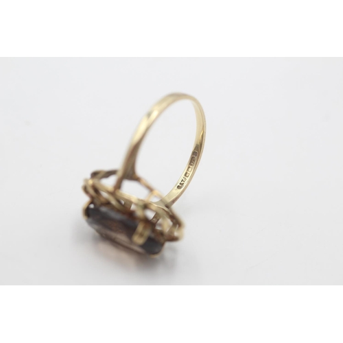 55 - A hallmarked Sheffield 9ct gold smoky quartz twisted frame cocktail ring, size P - approx. gross wei... 