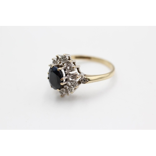 58 - A 9ct gold sapphire and diamond halo dress ring, size Q - approx. gross weight 3.3 grams