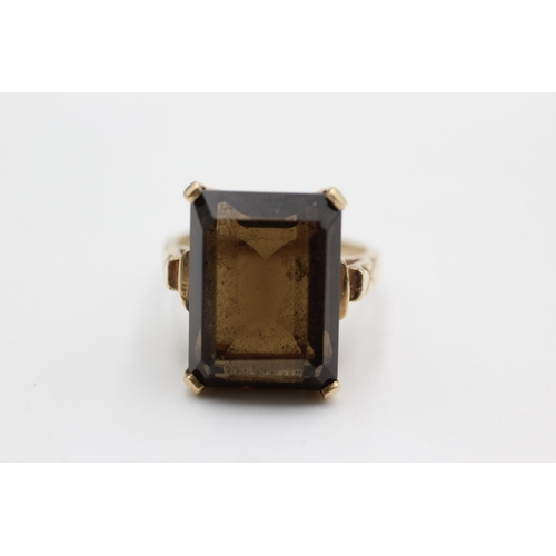 6 - A mid 20th century 10ct gold smoky quartz cocktail ring, size L½ - approx. gross weight 5.9 grams