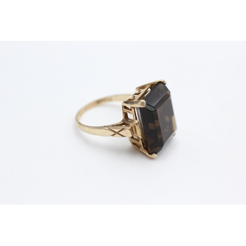 6 - A mid 20th century 10ct gold smoky quartz cocktail ring, size L½ - approx. gross weight 5.9 grams