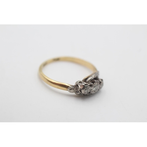 64 - An 18ct gold and platinum diamond trilogy ring, size M - approx. gross weight 2.5 grams