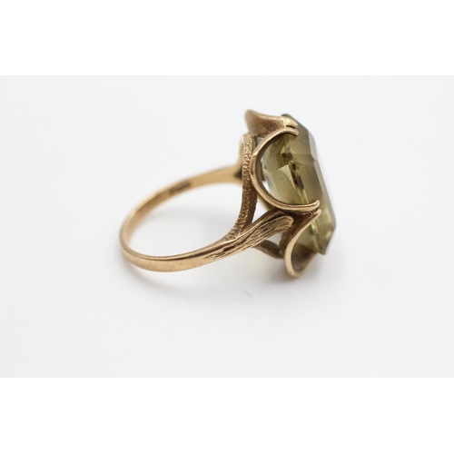 66 - A 9ct gold citrine solitaire buttercup setting cocktail ring, size O - approx. gross weight 6 grams