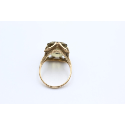 66 - A 9ct gold citrine solitaire buttercup setting cocktail ring, size O - approx. gross weight 6 grams