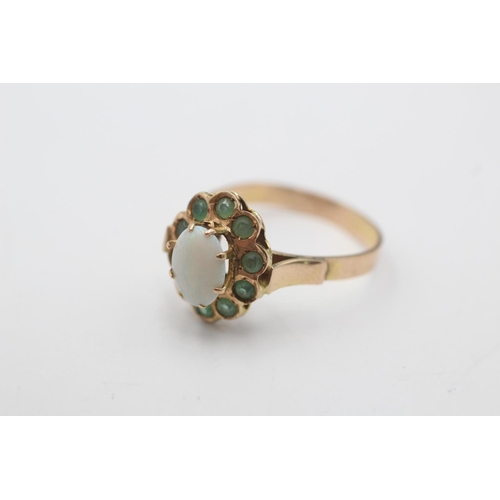 7 - A 14ct gold opal and emerald halo ring, size O - approx. gross weight 2.7 grams