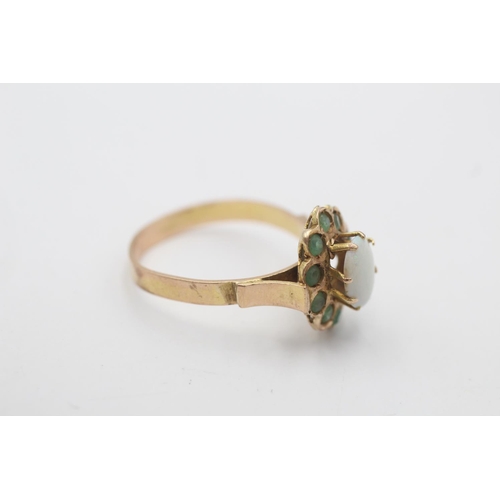 7 - A 14ct gold opal and emerald halo ring, size O - approx. gross weight 2.7 grams