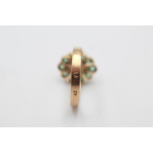 7 - A 14ct gold opal and emerald halo ring, size O - approx. gross weight 2.7 grams