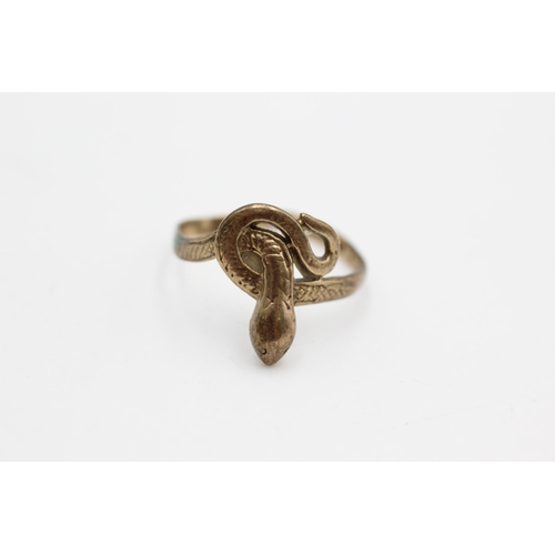 73 - A 9ct gold coiled snake knot dress ring, size O - approx. gross weight 1.9 grams