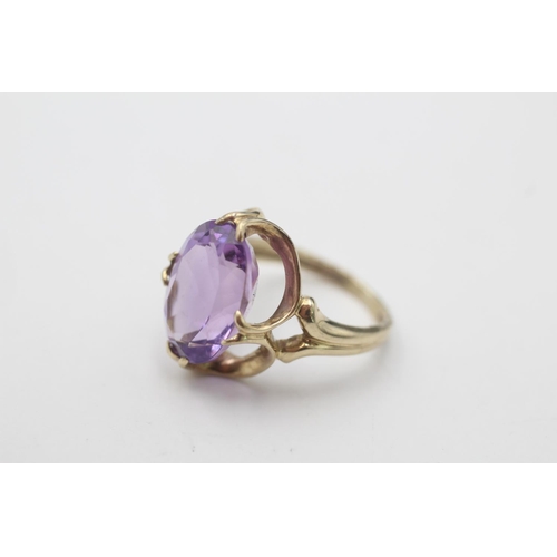 90 - A 9ct gold amethyst claw set cocktail ring, size H - approx. gross weight 3.2 grams