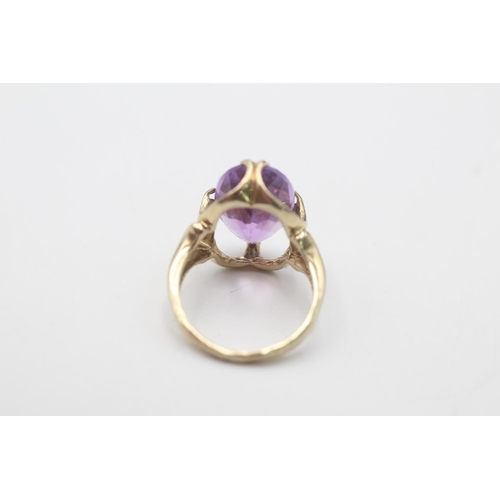 90 - A 9ct gold amethyst claw set cocktail ring, size H - approx. gross weight 3.2 grams