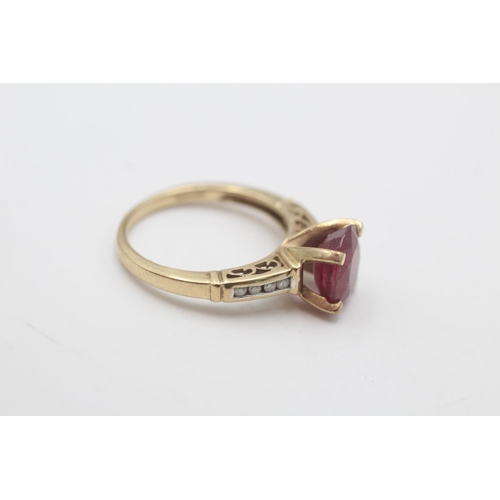 95 - A 9ct gold ruby and diamond dress ring, size N½ - approx. gross weight 3.5 grams