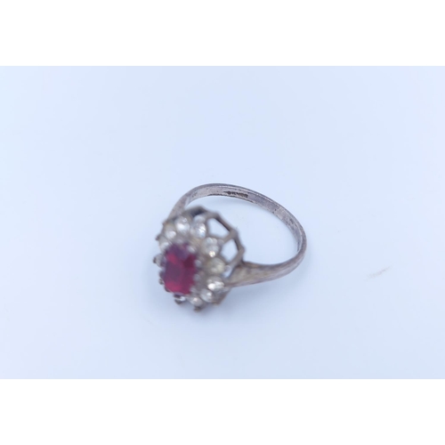 109 - A stamped silver red and clear gemstone floral cluster ring, size J - approx. gross weight 2.18 gram... 