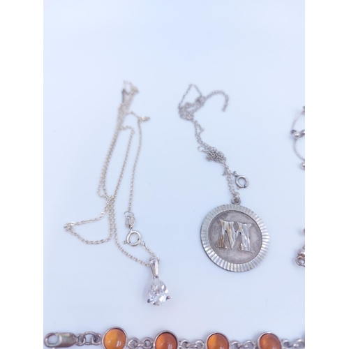 115 - A collection of various .925 sterling silver jewellery to include amber bracelet, letter 'M' pendant... 