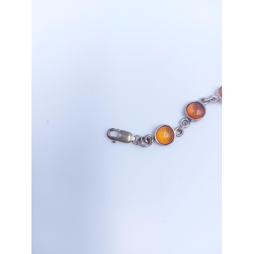 115 - A collection of various .925 sterling silver jewellery to include amber bracelet, letter 'M' pendant... 