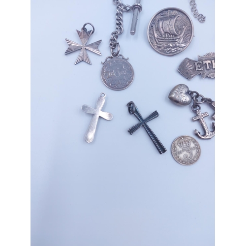 103 - A collection of various silver coins and jewellery to include hallmarked sterling silver albert chai... 