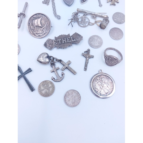 103 - A collection of various silver coins and jewellery to include hallmarked sterling silver albert chai... 