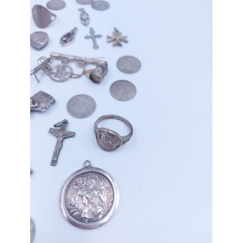 103 - A collection of various silver coins and jewellery to include hallmarked sterling silver albert chai... 