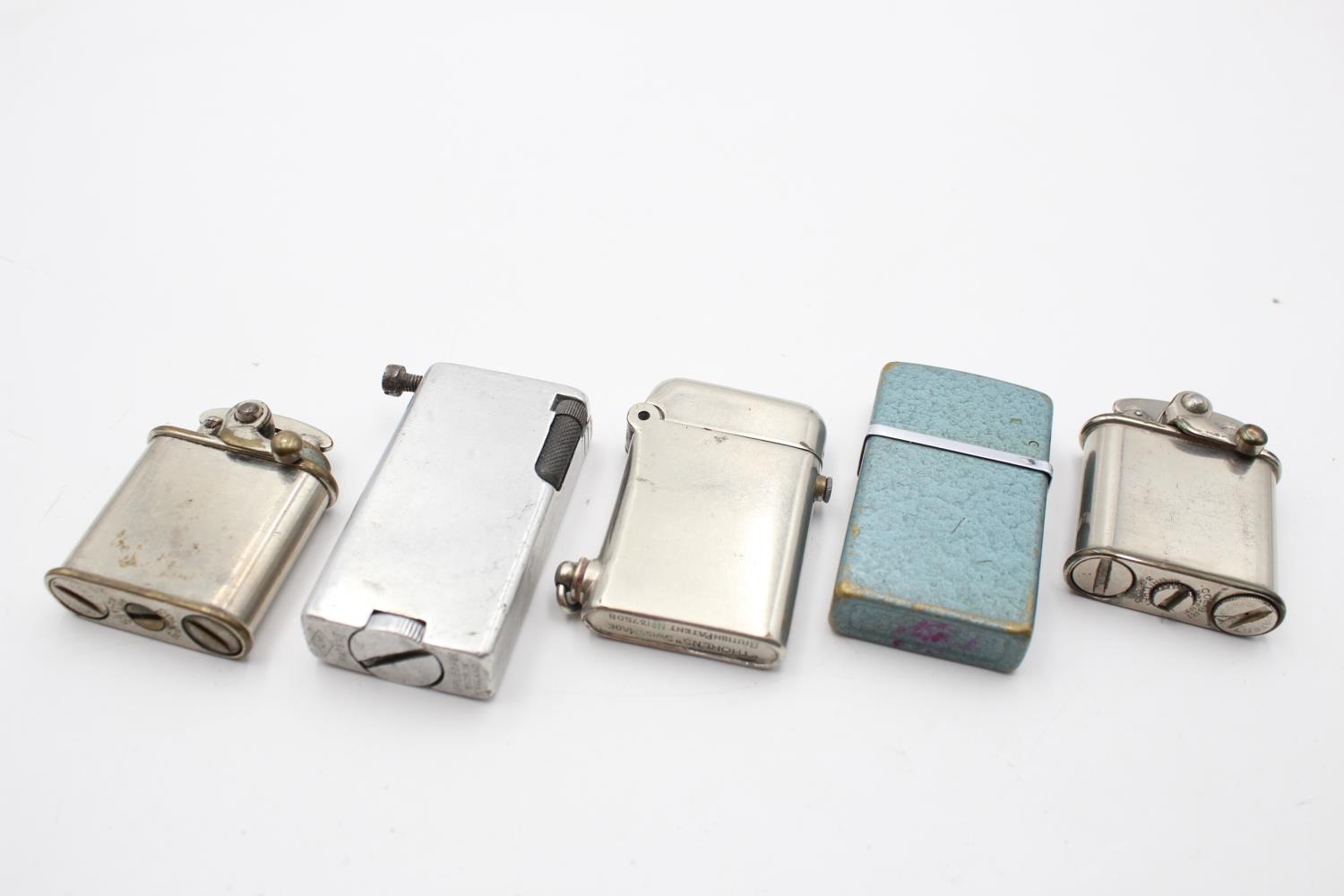 Five assorted cigarette lighters to include Thorens Swiss made 